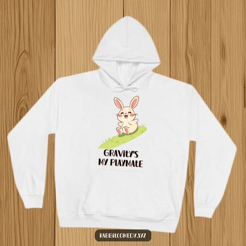 Funny hoodie featuring a giggling rabbit character comically rolling down a grassy incline, its expression one of pure surprise.