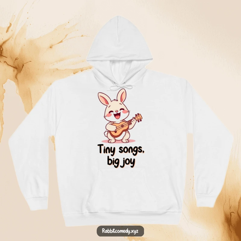 Funny hoodie featuring a happy rabbit playing a tiny ukulele, radiating musical joy and warmth.