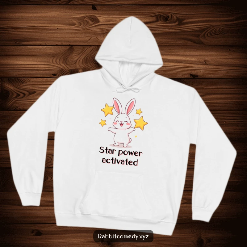 Funny hoodie featuring a cheerful rabbit juggling sparkly stars, radiating warmth and comical delight.
