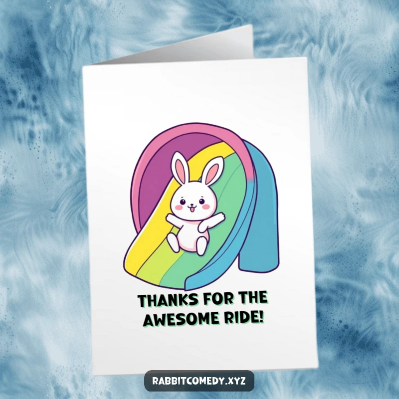 Funny free printable thank you card with a kawaii rabbit gleefully sliding down a rainbow, expressing thanks.