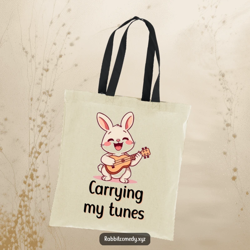 Funny tote bag showing a happy rabbit playing a small ukulele with a wide smile, perfect for carrying essentials.