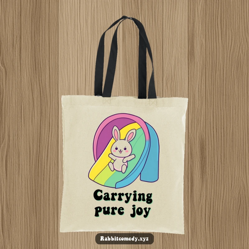 Funny Tote Bag: A kawaii rabbit gleefully slides down a rainbow, making it a humorous and vibrant accessory.