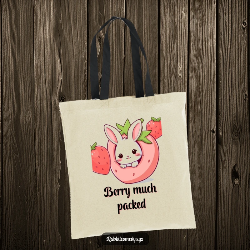 Funny Kawaii rabbit peeking out from a giant strawberry hole, perfect for this humorous and charming tote bag.
